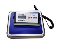 Set of scales with a blue top and remote indicator sitting on top of it photographed on a white background