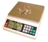 Weighing Scales with coins on top of it sitting on a white background
