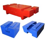 Image of one red block weight and two block weights on a white background
