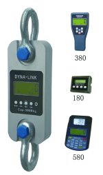 Grey and blue dynamometer with a range of remote devices next to it on a white background