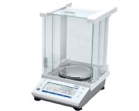 Large white laboratury balance with tall case over the weighing plate.