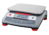Grey and stainless steel bench scale with red feet sitting on a white background