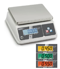 White and silver bench scale with coloured displays sitting on a white background