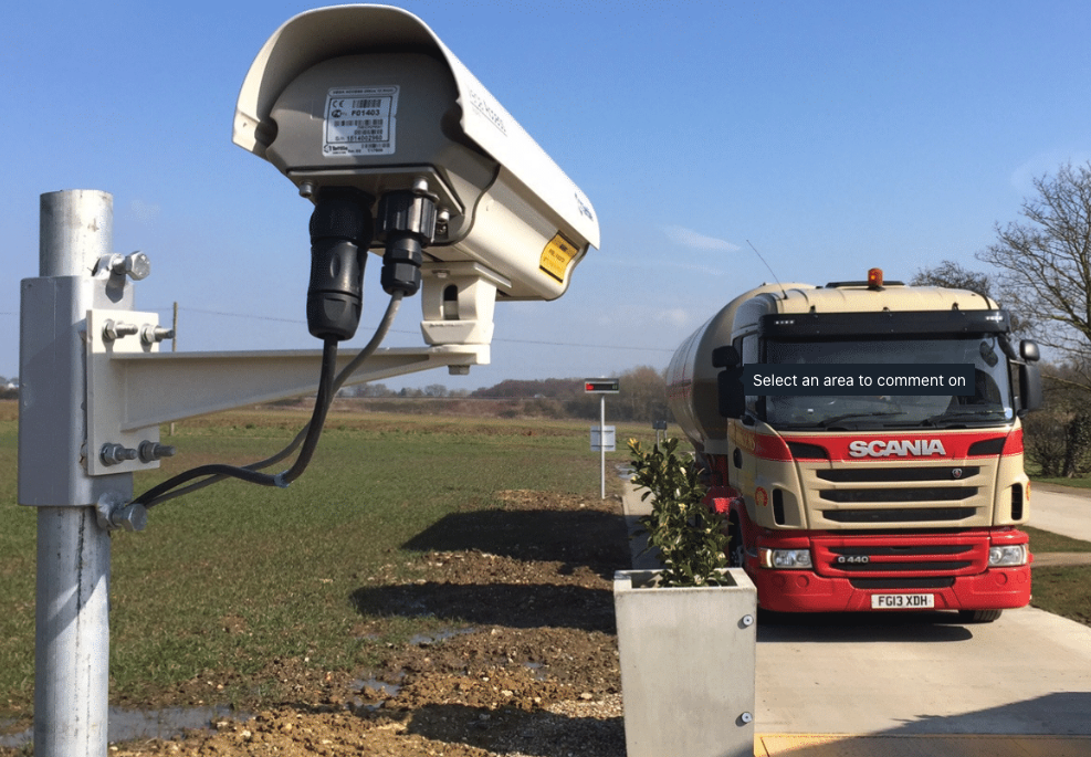 camera pointing towards a vehicle being weighed on a weighbridge