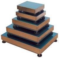 Stack of standard load cell bases pictured on a white background