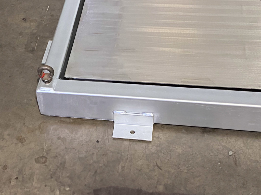 Close up of a heavy-duty protective frame for platform weighing scale to show how it can be bolted to a floor