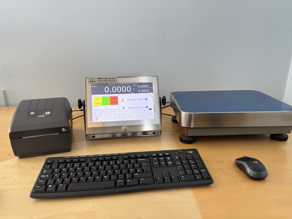 Image of a dual platform weighing and counting system on a wooden table