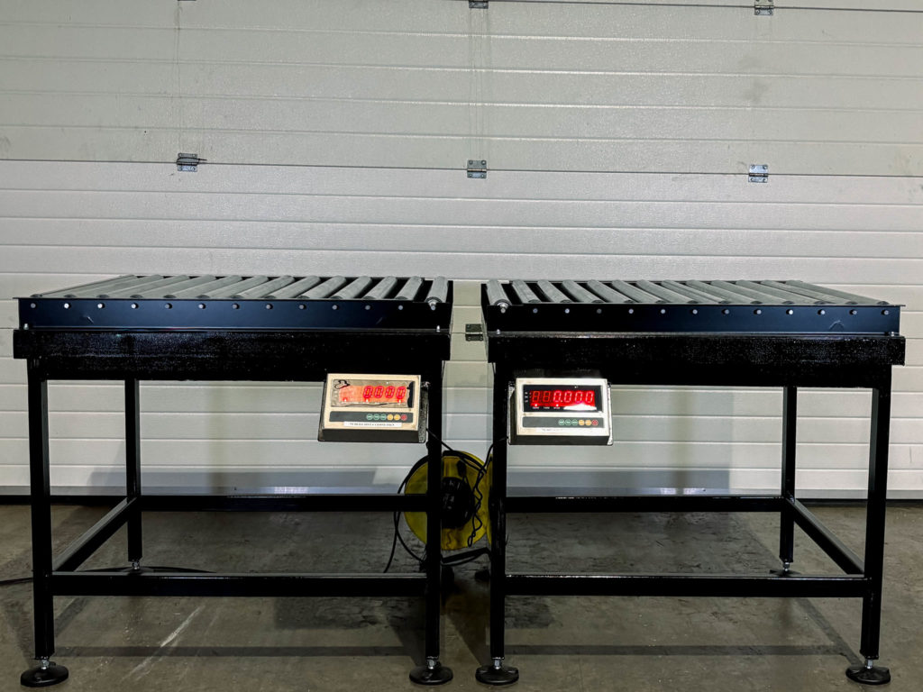 Two weighing platforms with roller belts and digital displays
